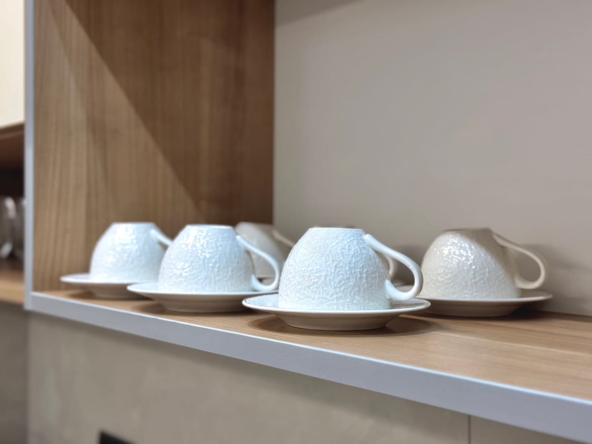 Coffee cups ready in the kitchen unit
