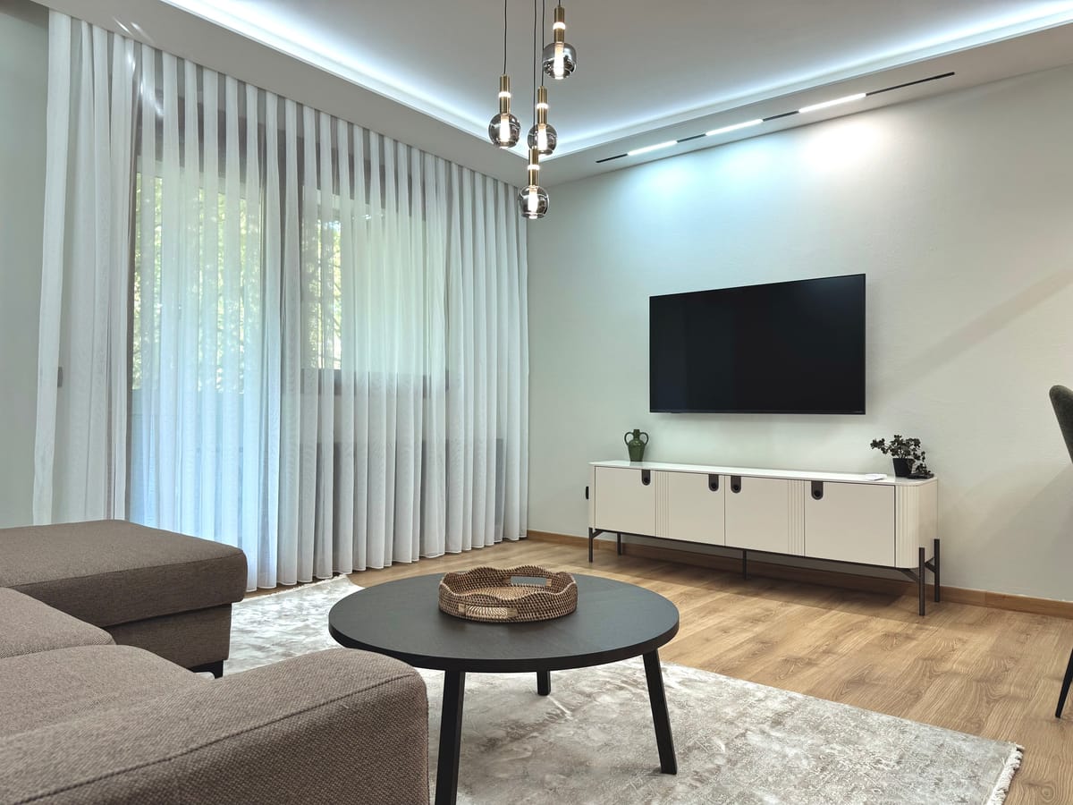 Living room with a window looking out to greenery